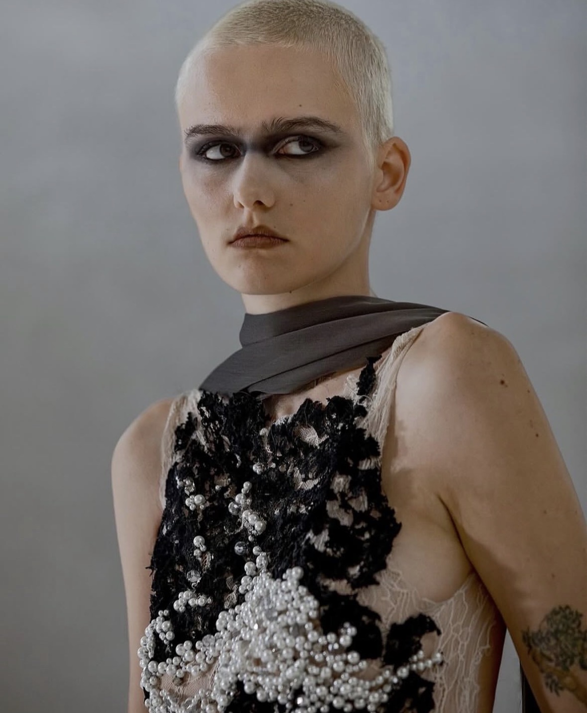Editorial portrait — pearl and lace bodice with smoky eye