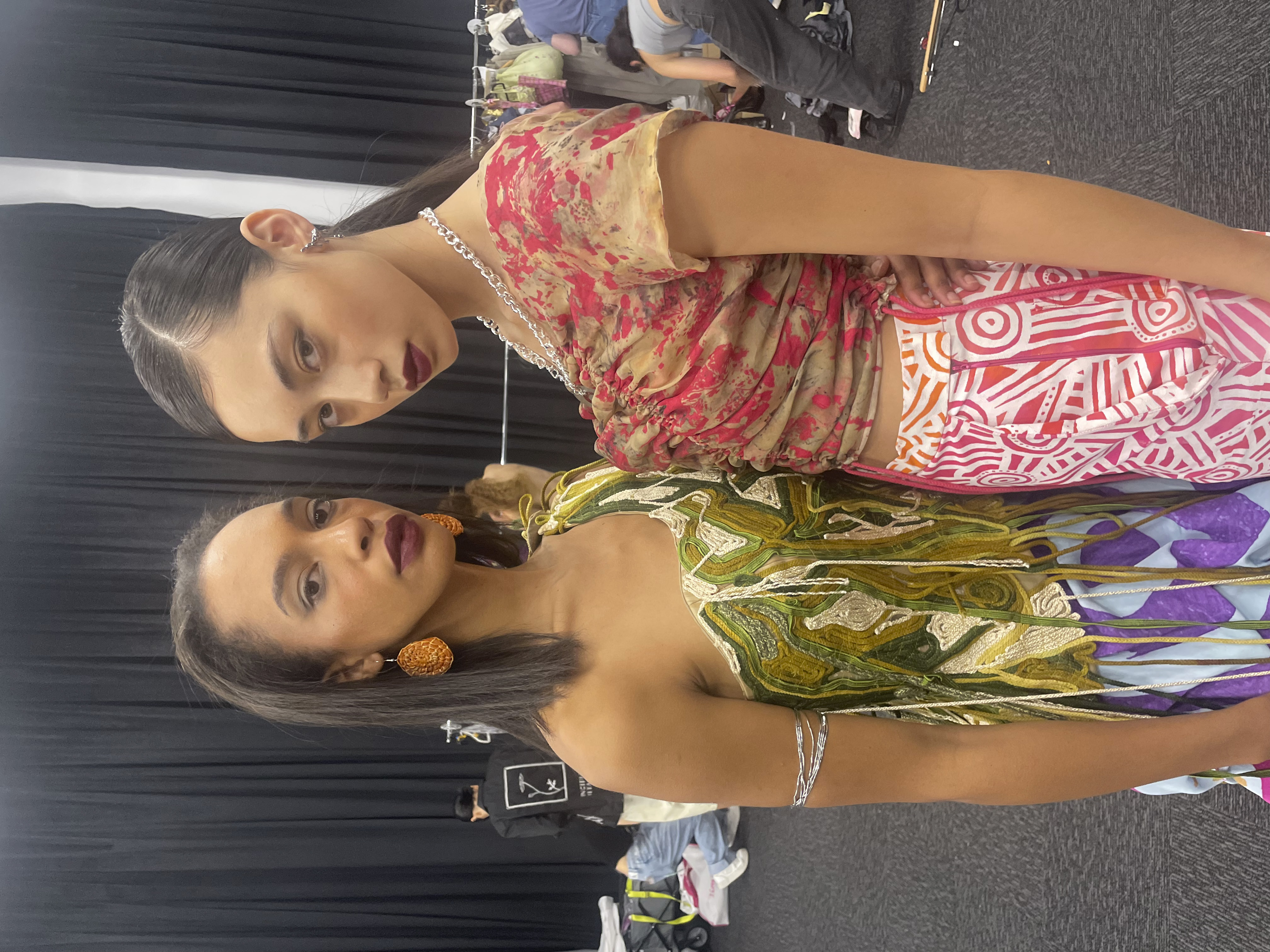 Runway pair — sheer black top with long earrings
