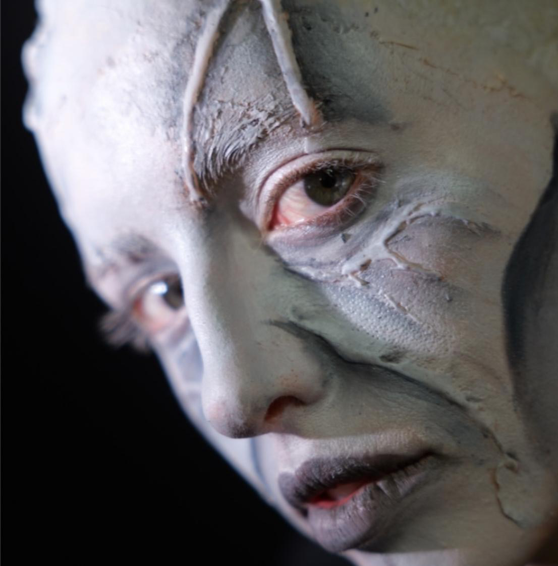 Textured creature character with dramatic eye makeup
