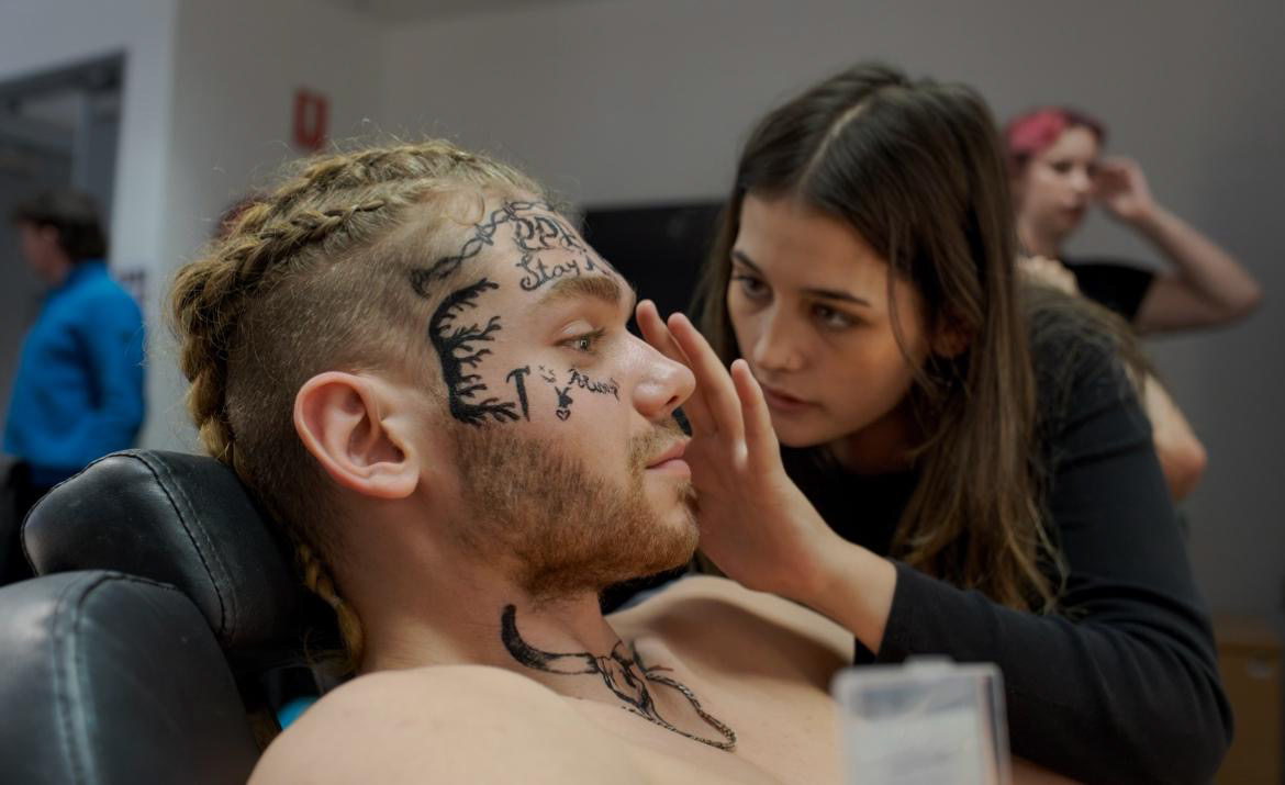 Painted face character — tattoos and stage paint