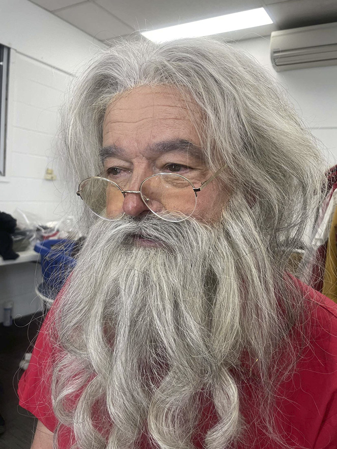 White face paint with floral grey wig